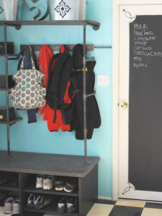 With some pipe shelves and a small bench, you can turn a corner of your basement into a mudroom for out-of-the-way coat and shoe storage, like blogger Jill of Junky Vagabond.
See more of this project at HomeTalk.
NEXT: The Best Ways to Organize Your Storage Spaces
 
