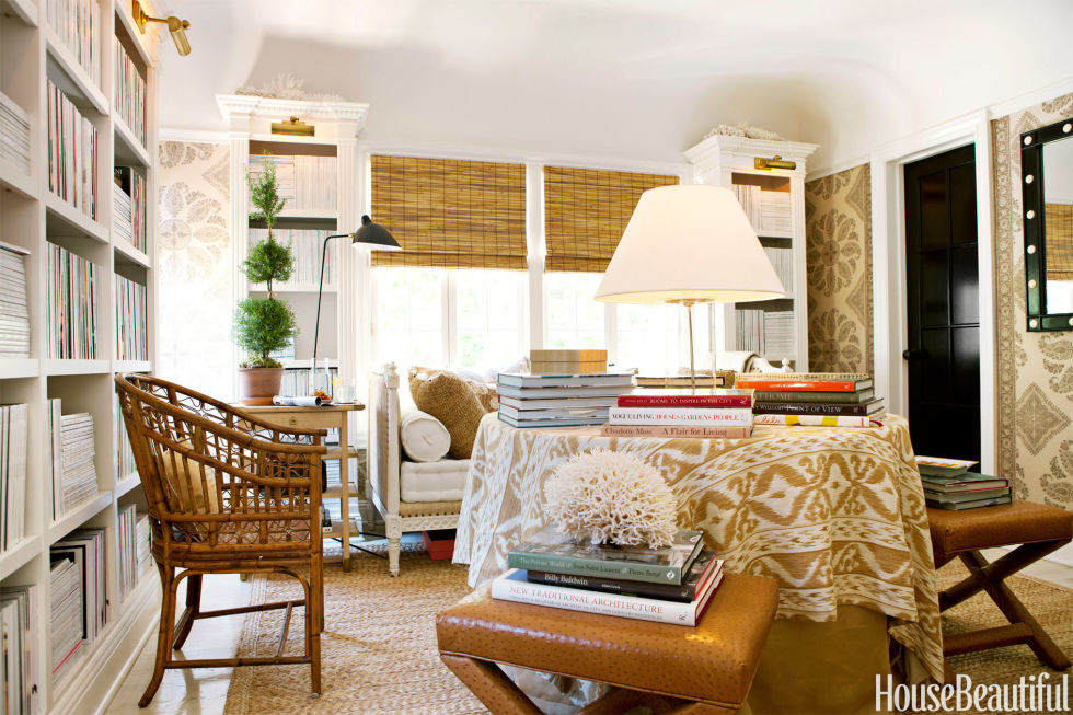 To give the library in his Los Angeles house "a cozy atmosphere," Mark D. Sikes covered the walls in Peter Dunham's Samarkand paisley. The center table is draped in Cowtan & Tout's Rapallo ikat. Built-in bookcases hold a 20-year collection of magazines. 