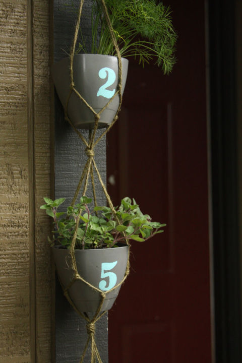 Knotted rope suspends these planters, which display this home's address number.<br />See more at Think Crafts »<br />