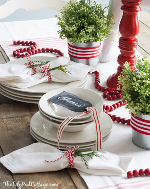 Instead of filling up the table with names, jot down a note of Christmas cheer on a DIY chalkboard tag. See more at The Lily Pad Cottage » 