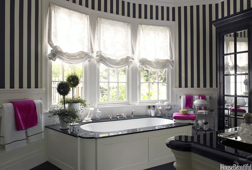 For a client who "wears lots of colors, and even more black and white," designer Stephen Shubel painted the walls of the master bath in bold black-and-white stripes. They complement the black-and-white master bedroom in the San Francisco house.
